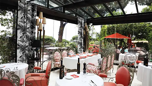 Open terrace of the Dolce Vita restaurant with panoramic bay views.