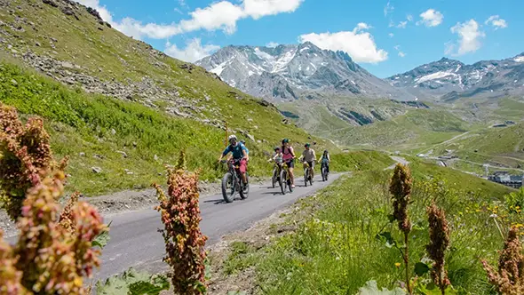 Group riding e-bikes in the mountains.