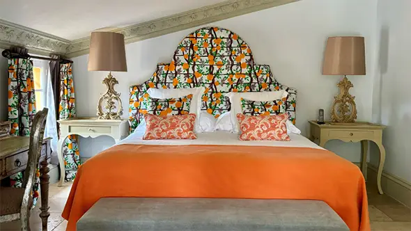 Spacious Junior Suite with a balcony and pine forest views.