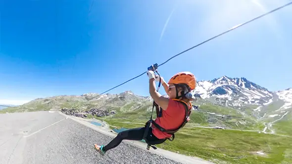Zipline descent over the valley.