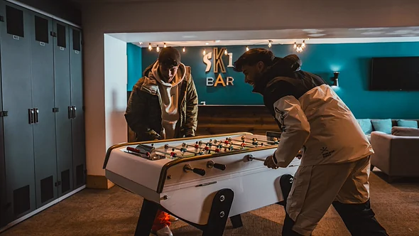Ski Bar sign, table football and heated lockers in the ski room at Fahrenheit Seven Val Thorens