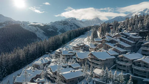 Aerial view of the Le K2 Palace hamlet in winter, Courchevel 1850