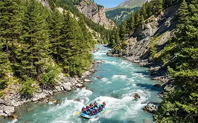 Whitewater rafting on a turbulent mountain river in the Alps