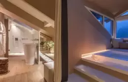 Penthouse Suite bathtub beside the attic windows, Hotel Mont-Blanc Chamonix