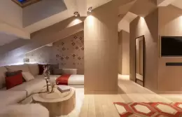 Penthouse Suite living room with corner sofa and log coffee table, Hotel Mont-Blanc Chamonix