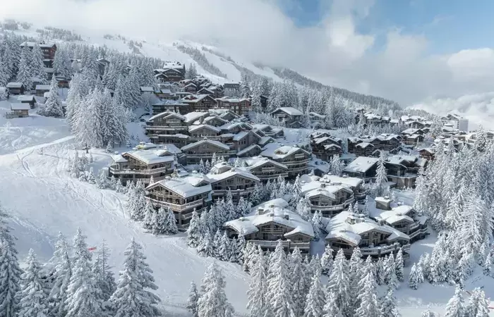 Aerial view of the hamlet above the forest at Le K2 Palace, Courchevel 1850