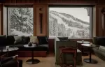 Sofas in the Salon facing the window onto the piste and the village