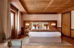 Elegant Prestige room at Fouquets Courchevel with Alpine views.