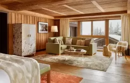 Bright Prestige Junior Suite interior with a large bed and stylish furniture.