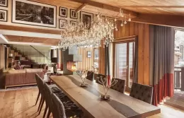Penthouse living room with a modern fireplace and panoramic windows.
