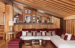 Penthouse living room with a modern fireplace and panoramic windows.