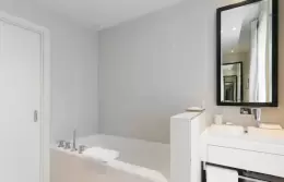 Prestige Plus Room bathroom with bathtub and white vanity, Hotel Mont-Blanc Chamonix