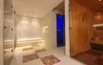 Spa area with mosaic floor and wooden sauna, Spa by Clarins at Hotel Mont-Blanc Chamonix