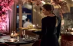 A waitress carrying a tray through the dining room of L&rsquo;Altitude, Le K2 Altitude