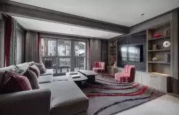 The living and dining room of a Suite Deluxe at Le K2 Chogori, Val d'Isere