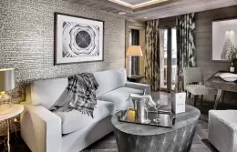 Junior Suite 2 sitting area with a white sofa and a round grey table, Lys Martagon, Courchevel 1850