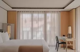 Bedroom in a deluxe suite at Aman Rosa Alpina