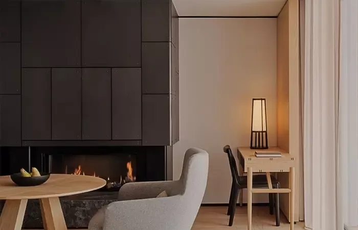 Fireplace in a deluxe room at Aman Rosa Alpina.