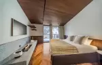 Bedroom with a fireplace in chalet Cristal in Val d-Isere.