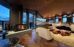 Living room with a fireplace in chalet Cristal in Val d-Isere