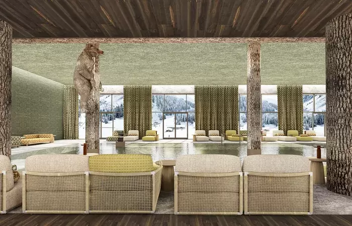 Indoor pool with a carved wooden bear and loungers facing the snowy slopes at Barma Hotel & Spa, La Tania