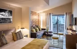 The sitting area by the balcony window in a Junior Suite, Hotel Hermitage, Breuil-Cervinia