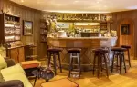 The curved bar counter with bar stools at Hotel Hermitage, Breuil-Cervinia