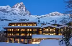 The hotel lit at dusk below the Matterhorn, Hotel Hermitage, Breuil-Cervinia