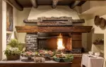 The open grill hearth of the La Chandelle restaurant, Hotel Hermitage, Breuil-Cervinia