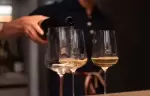 Sparkling wine being poured into three glasses at No. 14 Verbier